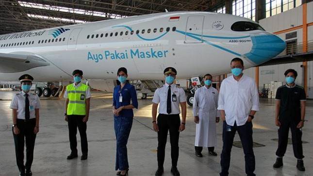 Heboh  Pesawat Garuda Pakai Masker, Erick Thohir: Terima Kasih Garuda